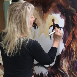 Grace Bailey painting lion Grace Bailey painting lion
